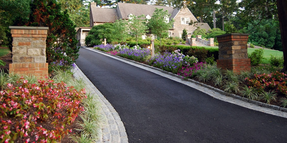 long driveway with flowers